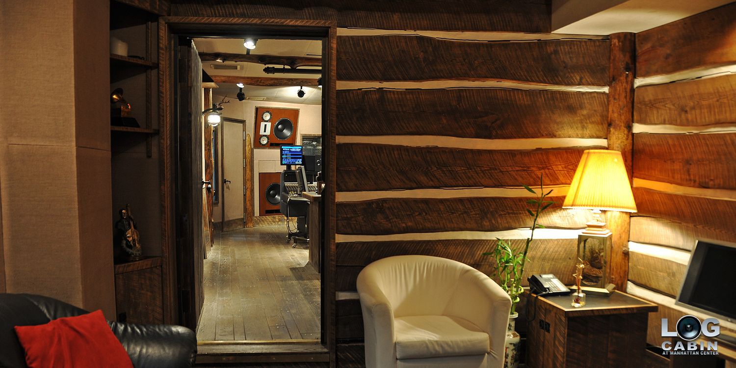 wooden wall and open door looking into studio