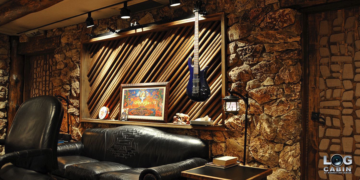 stone-walled room with couch