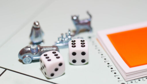 Close-up of Monopoly game pieces.