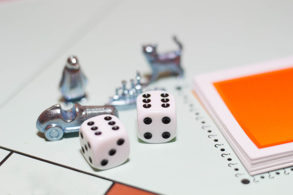 Close-up of Monopoly game pieces.