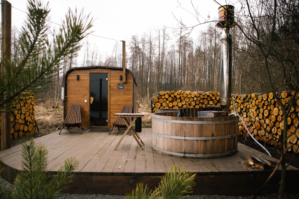 Wooden outdoor sauna in a forest.