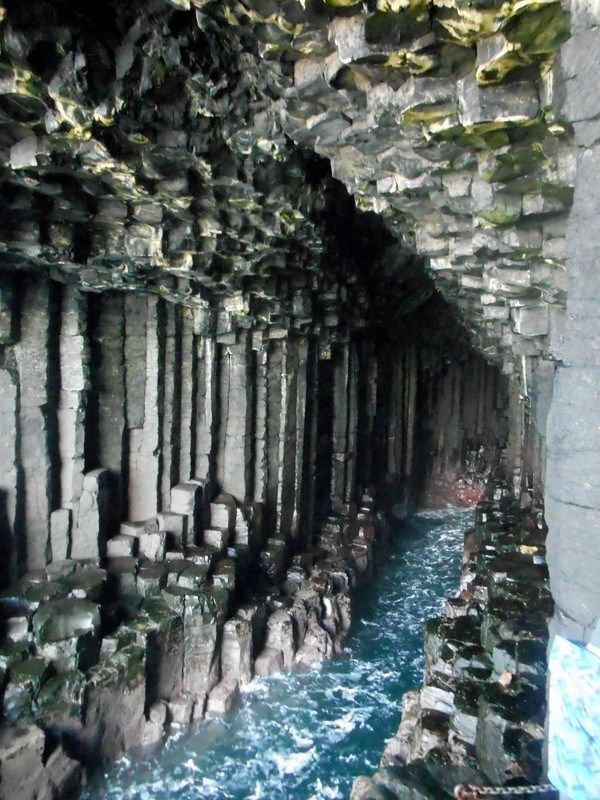 A cave with water and rock columns