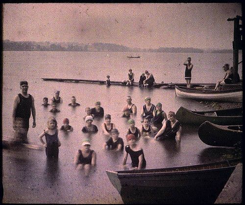 People pose for photo in a lake