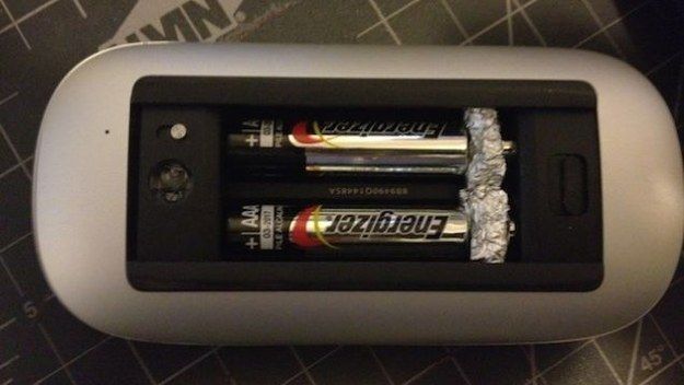AAA batteries in AA battery slot with tinfoil at the ends