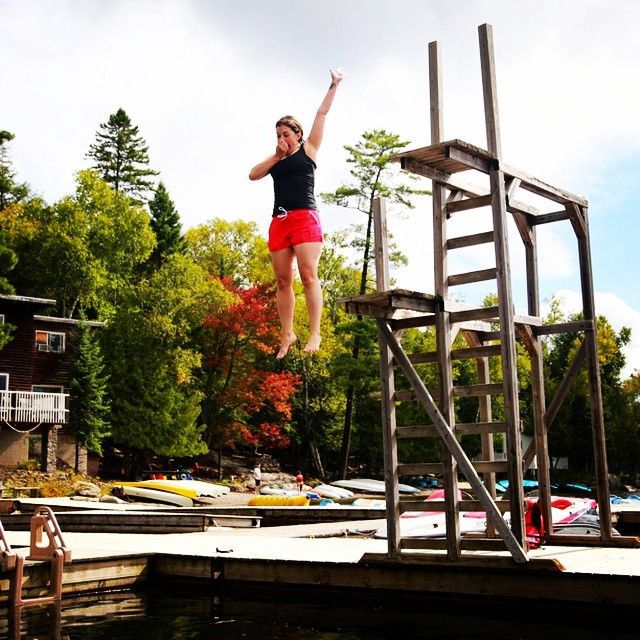 Woman jumping off diving platform