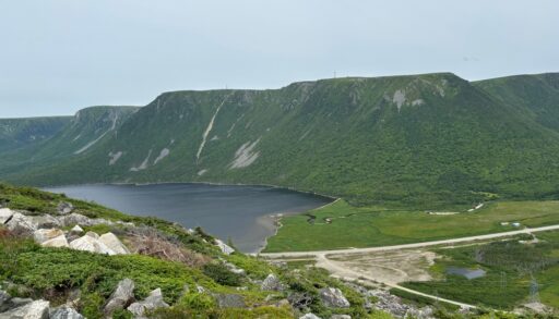 The green mountains and a blue lake in the Codroy Valley, Newfoundland.