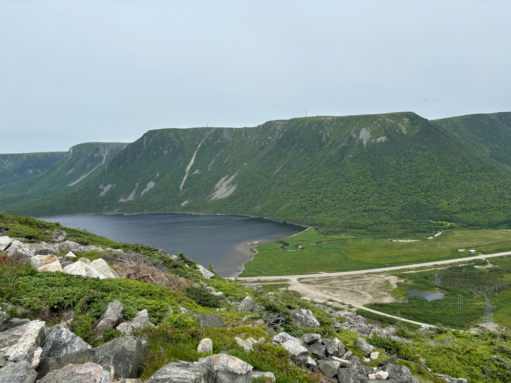 The green mountains and a blue lake in the Codroy Valley, Newfoundland.