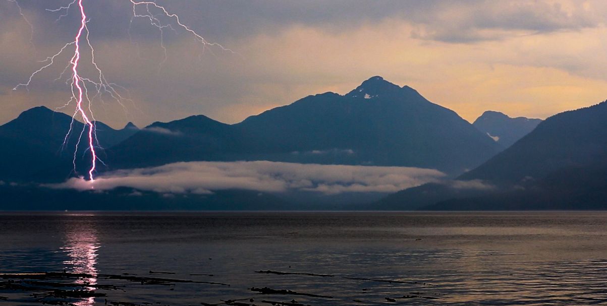 Lightnin striking near mountains