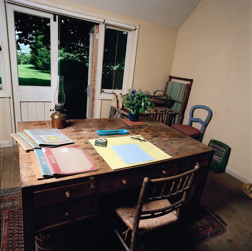 Interior of Virginia Woolf's hut, wiht a table and open doors