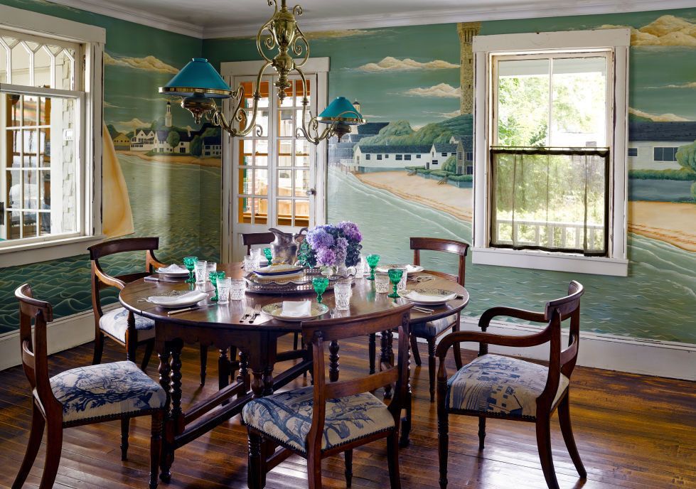 dining room with beach painting on wall