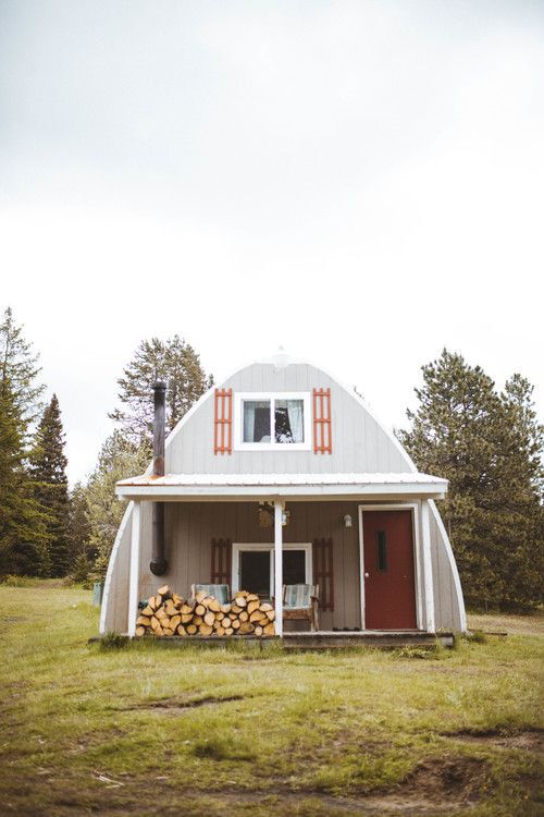 U-shaped cottage with firewood