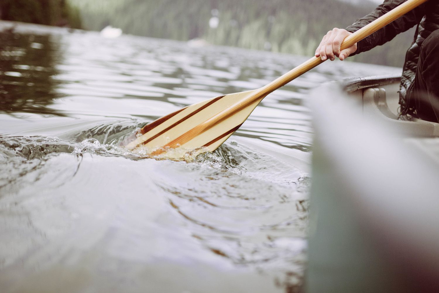 Oar dipping into water