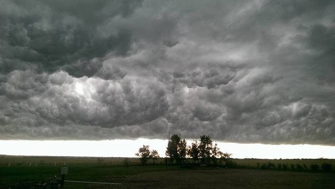 churning clouds over field