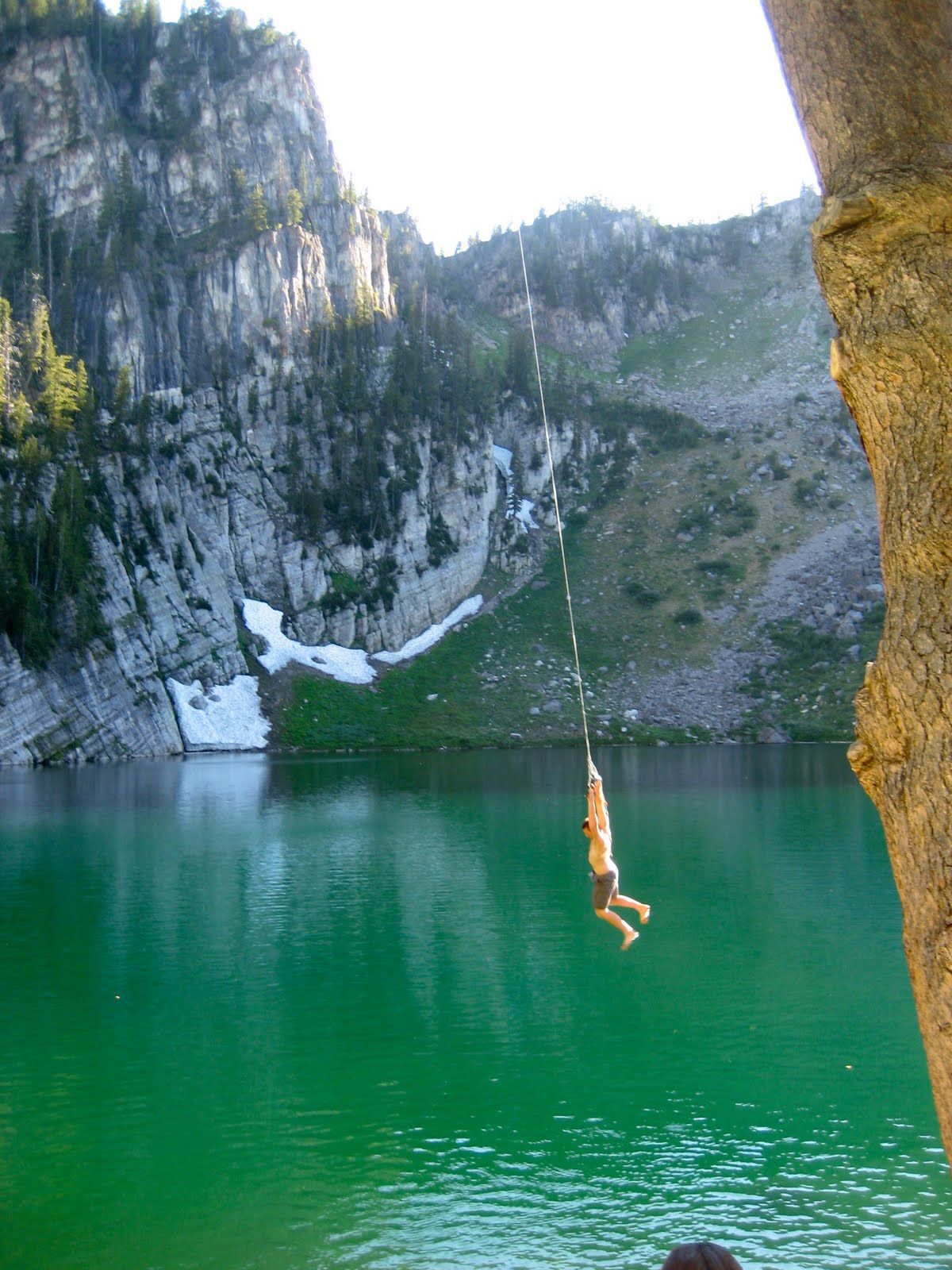 Man swinging high over water