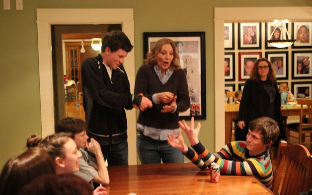 People acting out charades