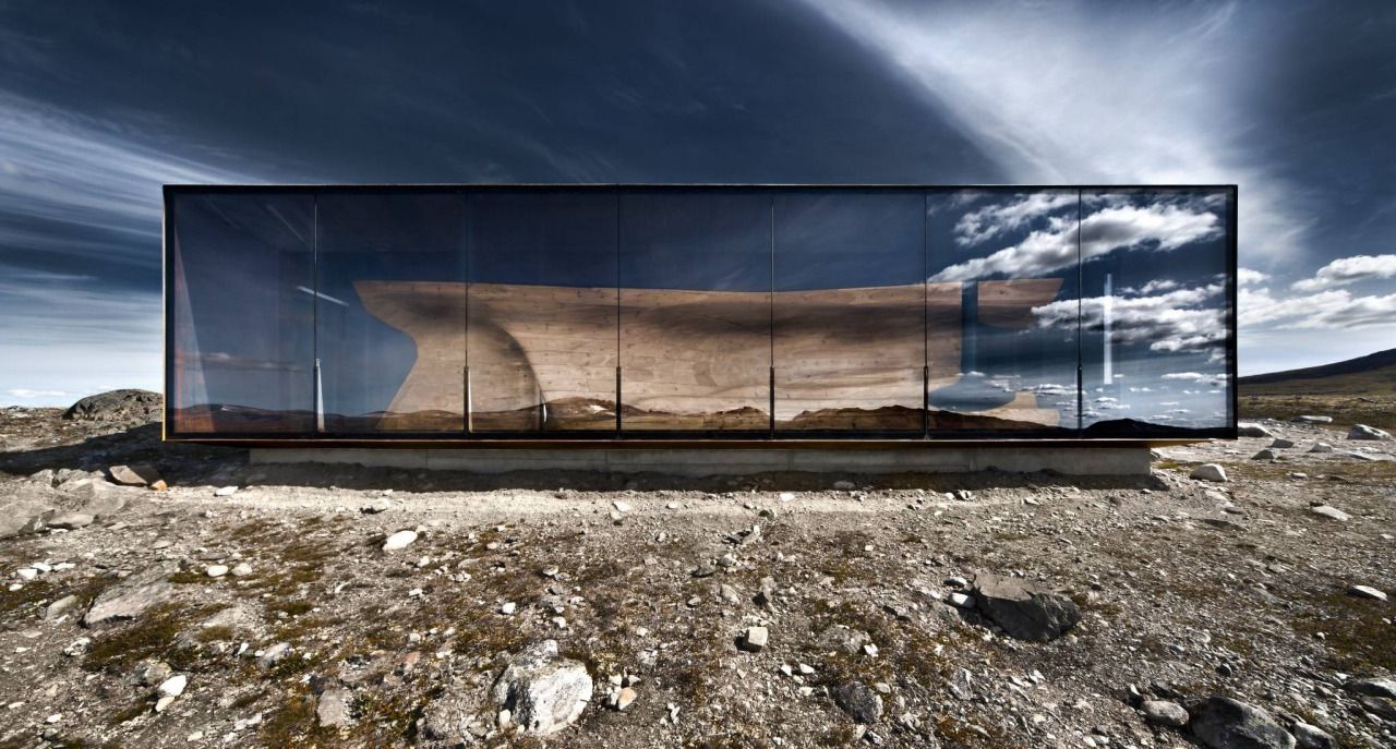 Glass building with wood seating inside