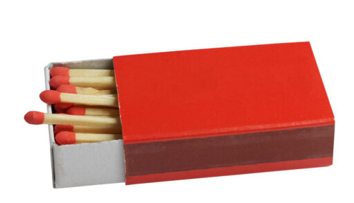 Red box of matches with red-tipped matches inside.