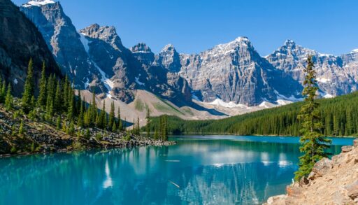 Blue lake and surrounding mountains at Moraine Lake, Banff, Canada.