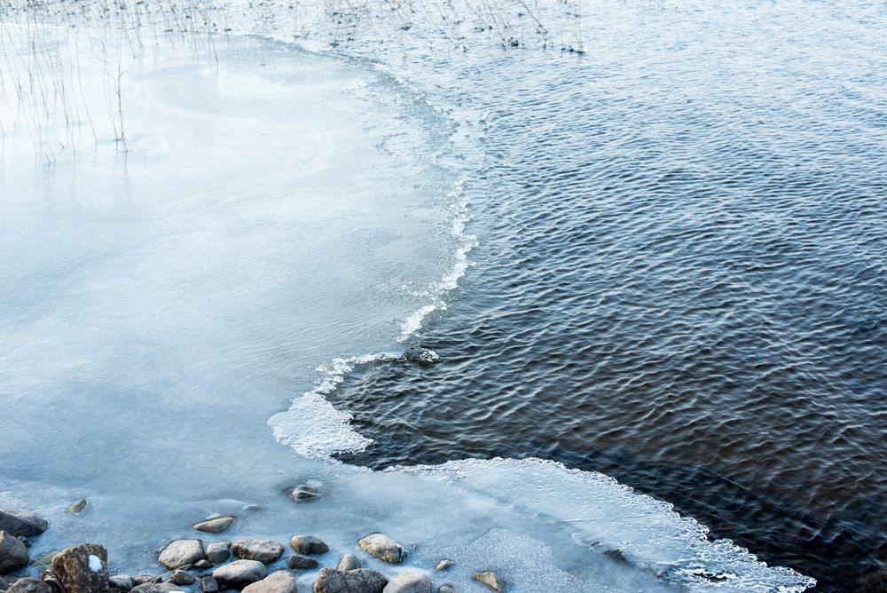 Partly frozen lake in the winter time.