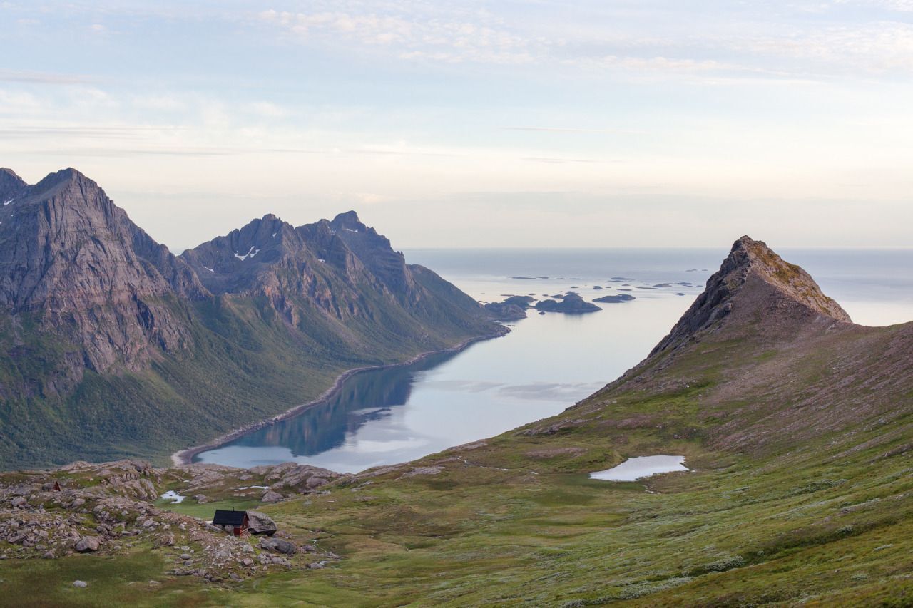 cabin at base of mountains