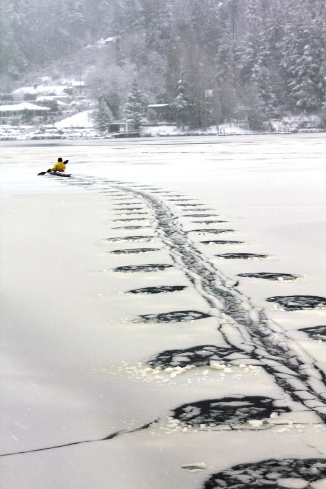 Ice on a like cracked in interesting formation by kayaker