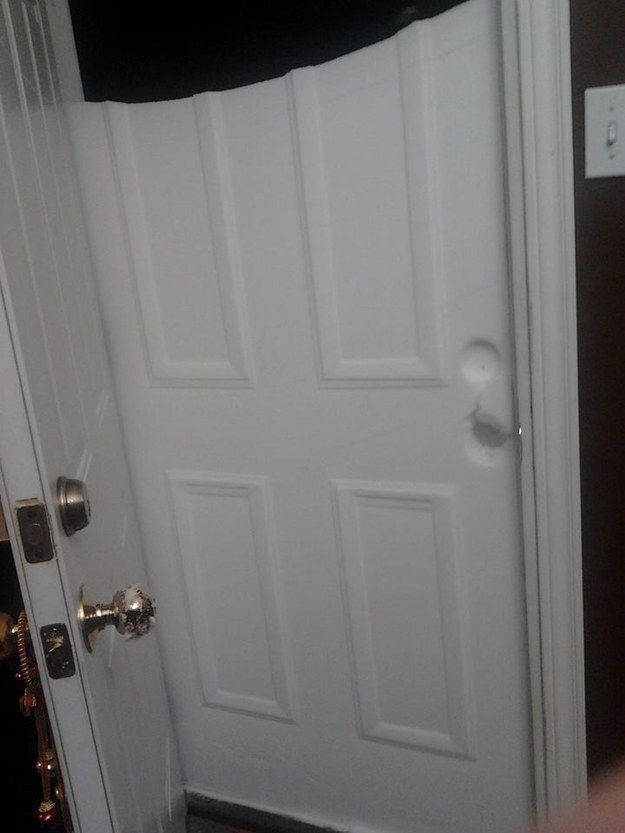 Door opened to show imprint of door in snow