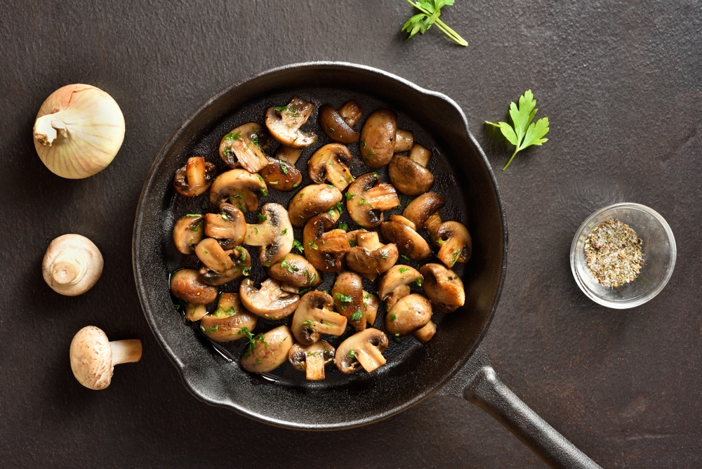 Roasted mushrooms in a cast iron pan.