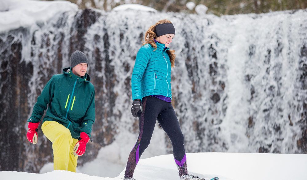 Couple snowshoeing in the winter.