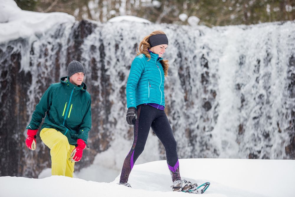 Couple snowshoeing in the winter.