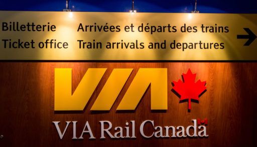 Via Rail departures board lit up in Quebec City, Canada.