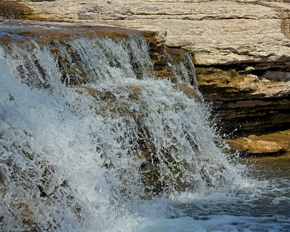 Cascading waterfall flowing down rocks.
