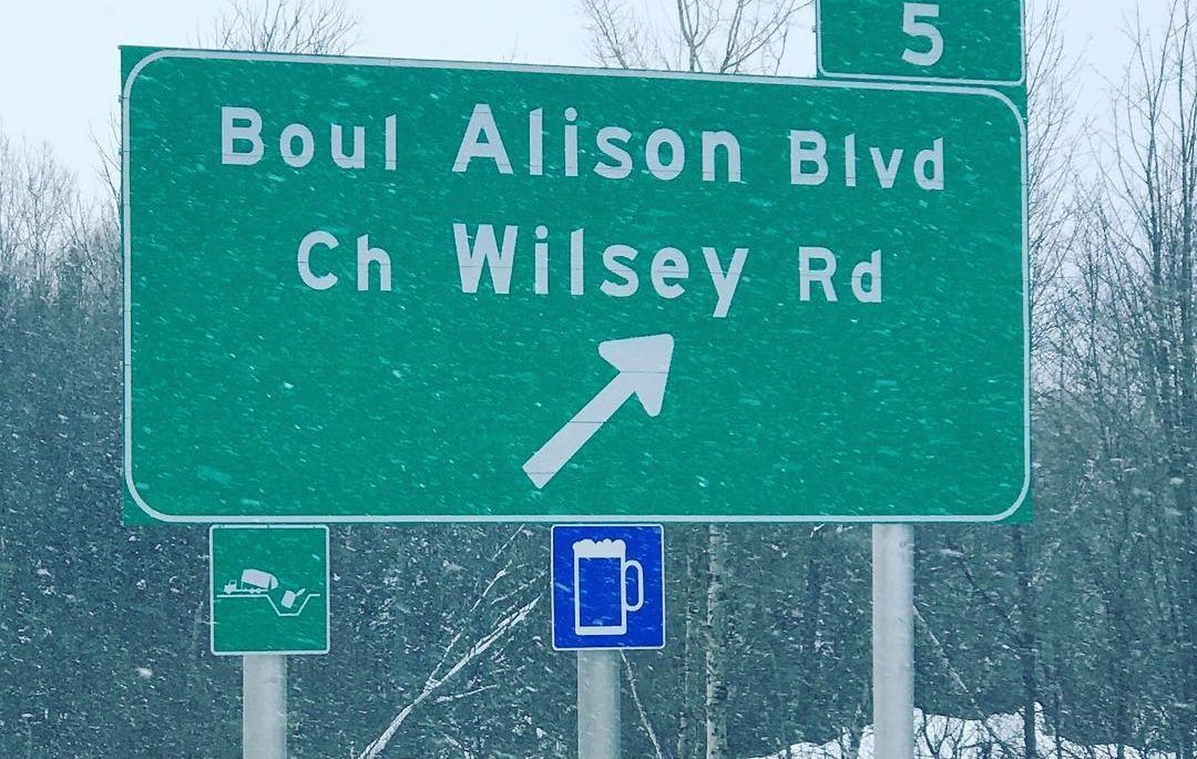 Road sign with a blue beer symbol