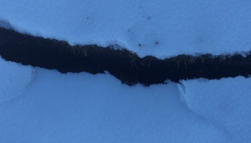 crack in snowy ground