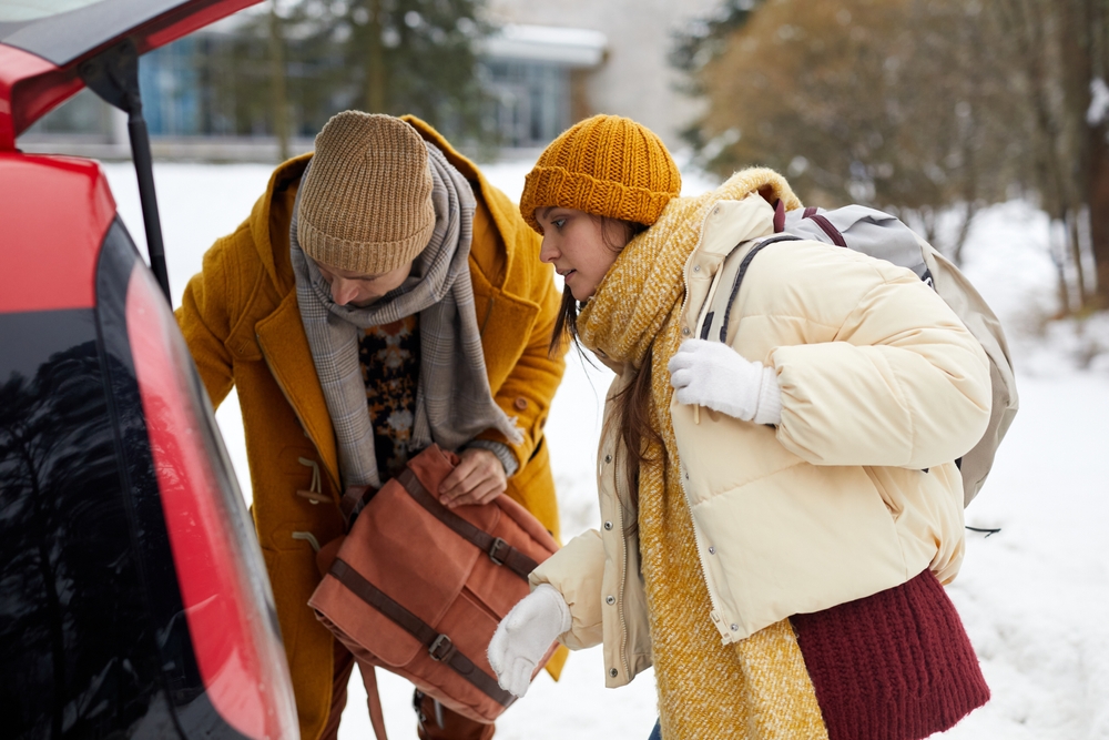couple packing the car in winter