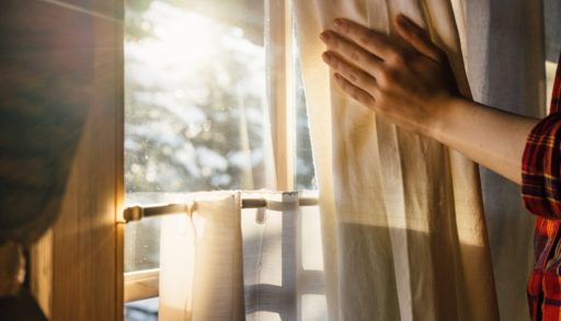 Opening-curtains-at-cottage