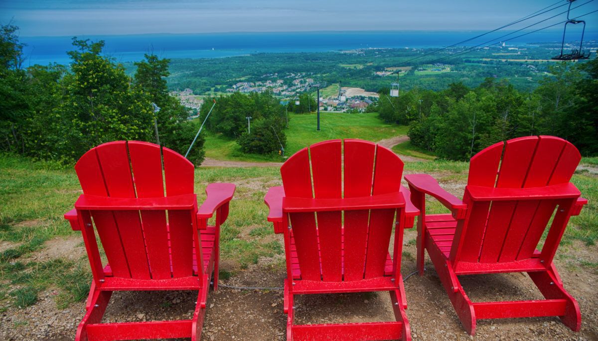 red-muskoka-chairs-at-ski-resort-in-blue-mountain
