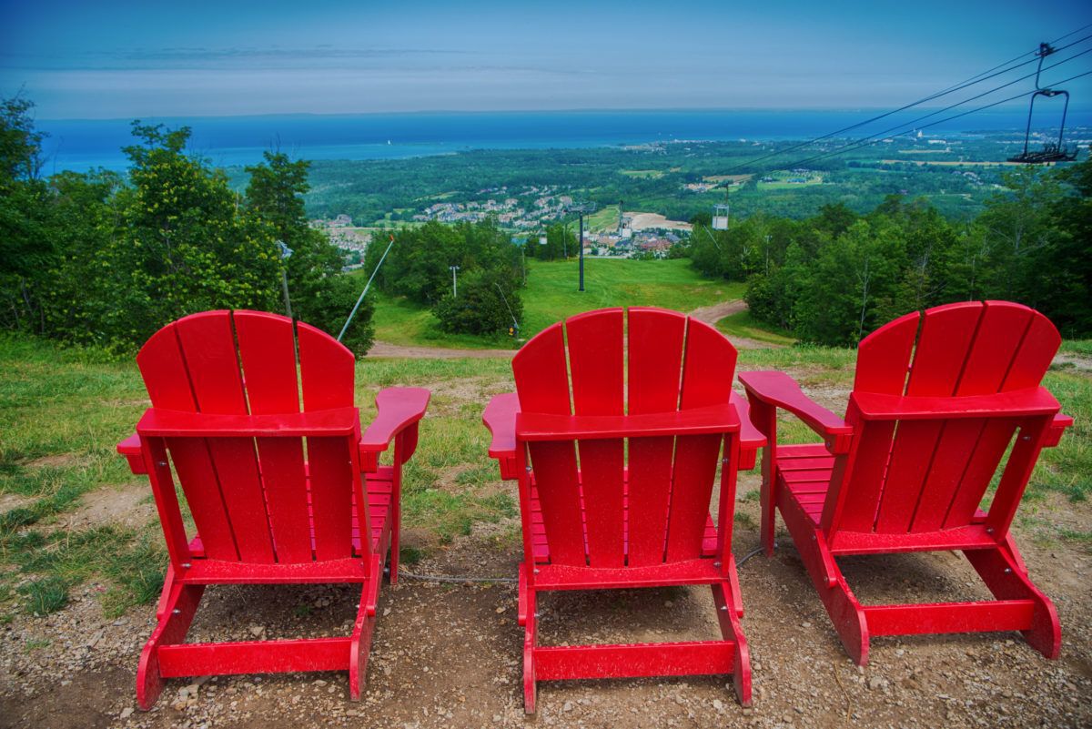red-muskoka-chairs-at-ski-resort-in-blue-mountain