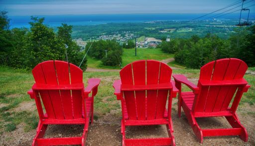 red-muskoka-chairs-at-ski-resort-in-blue-mountain
