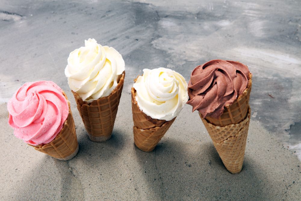 Four waffle cones with ice cream