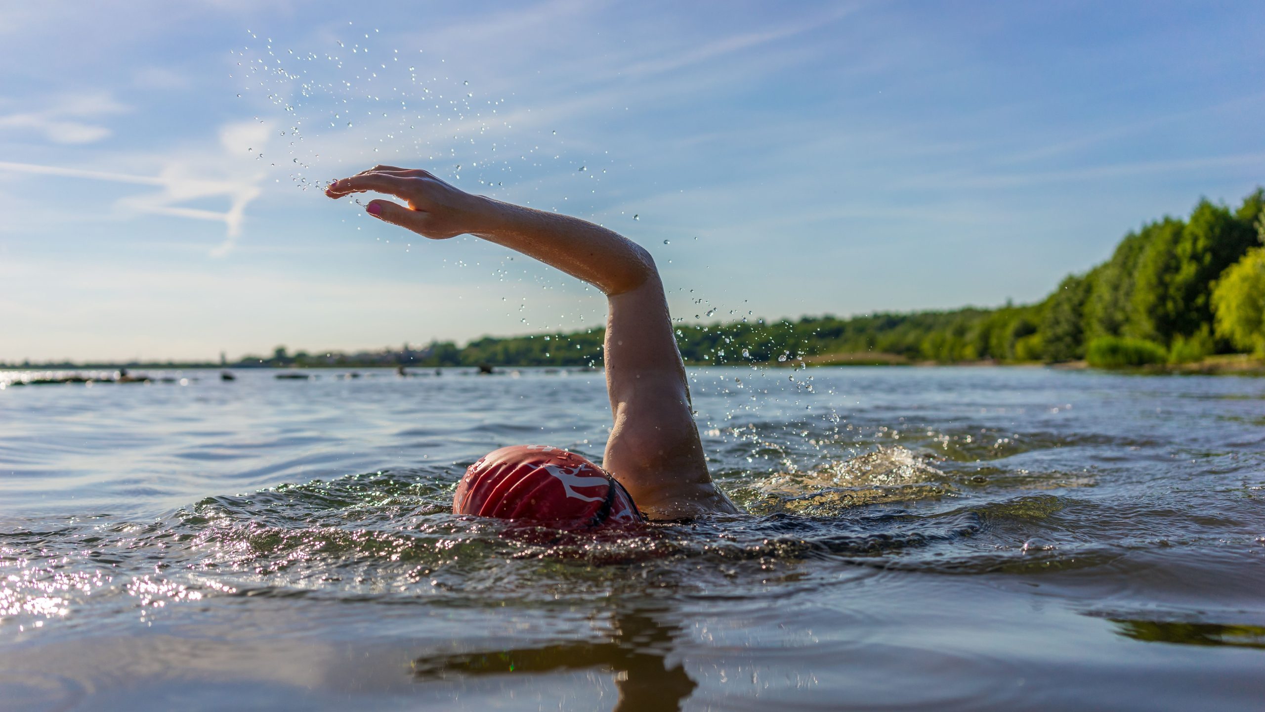 Person swimming in lake