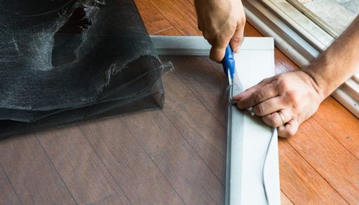 person-fixing-a-screen