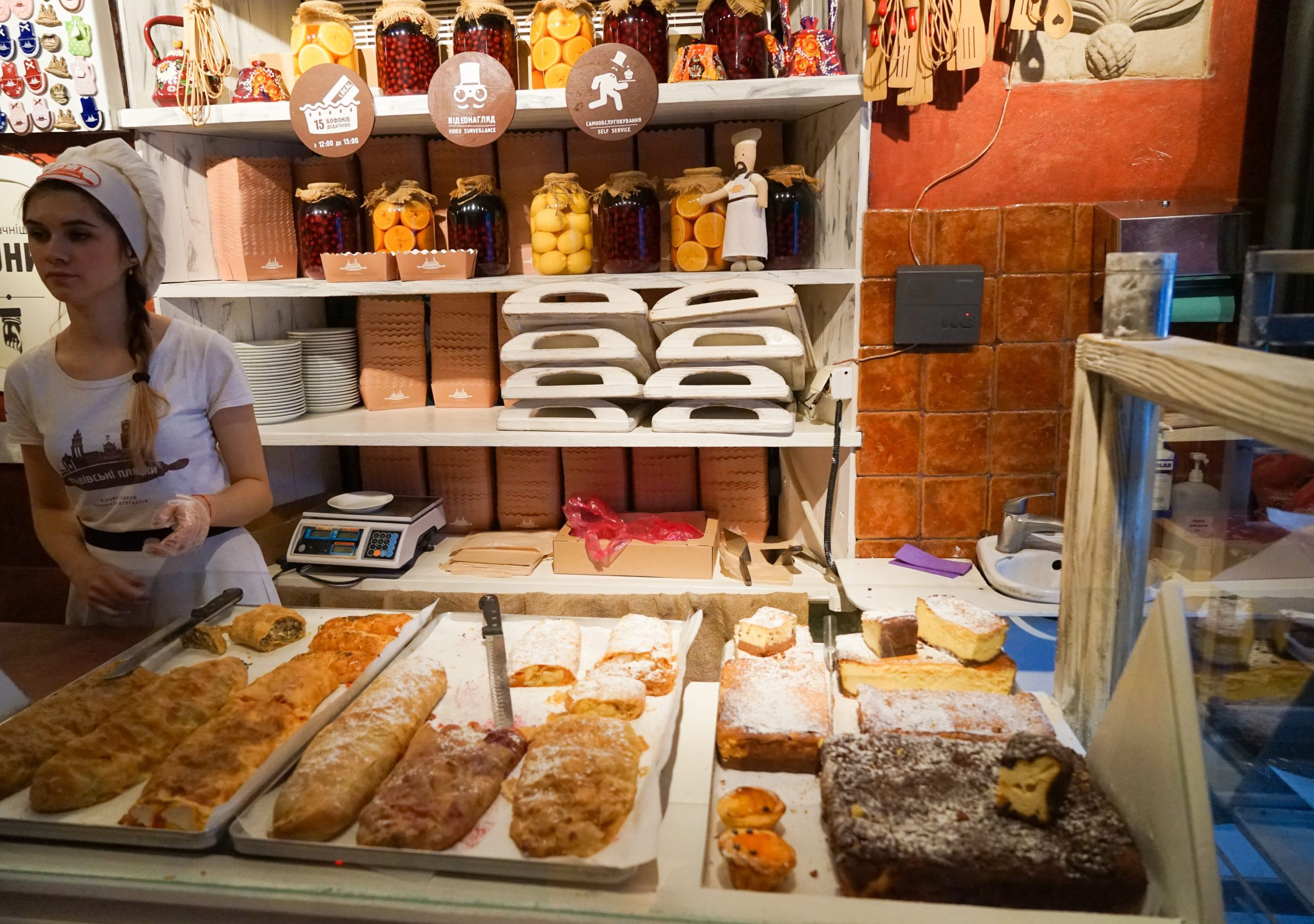 Young-woman-serving-a-customer-in-a-bake-shop
