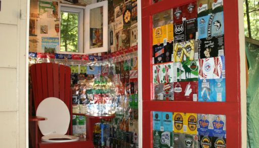 beer can decorated outhouse