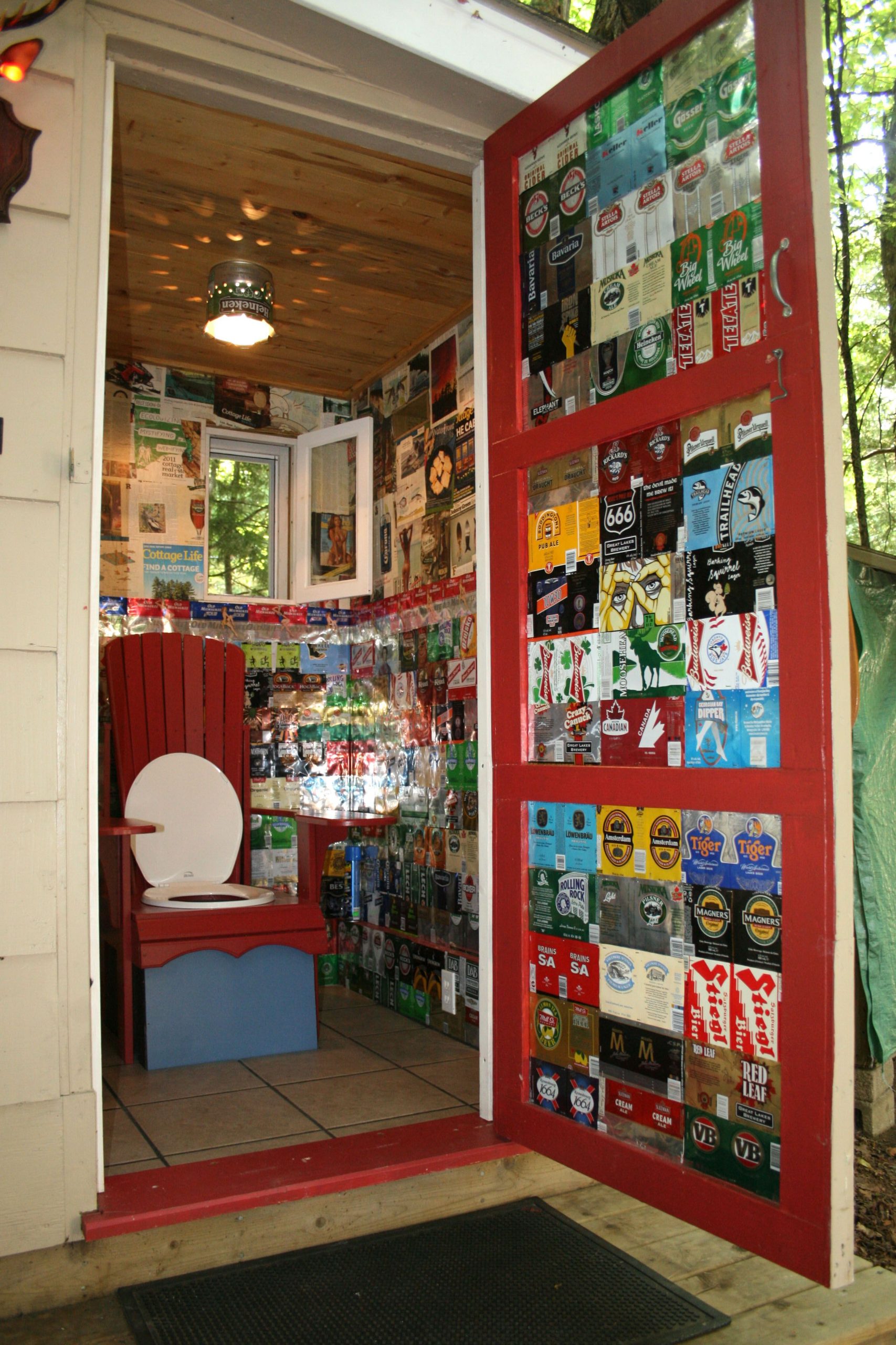 beer can decorated outhouse