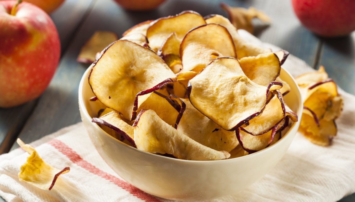 Baked apple chips in a bowl