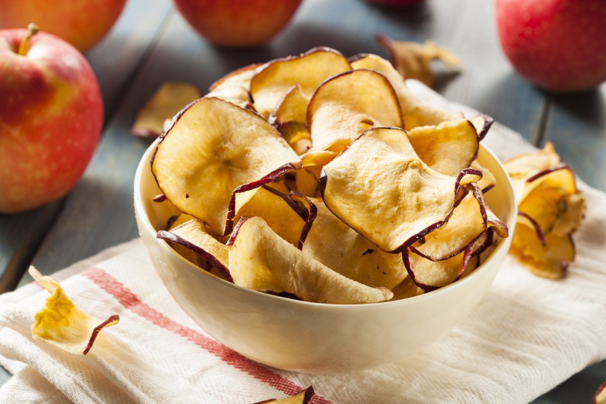 Baked apple chips in a bowl