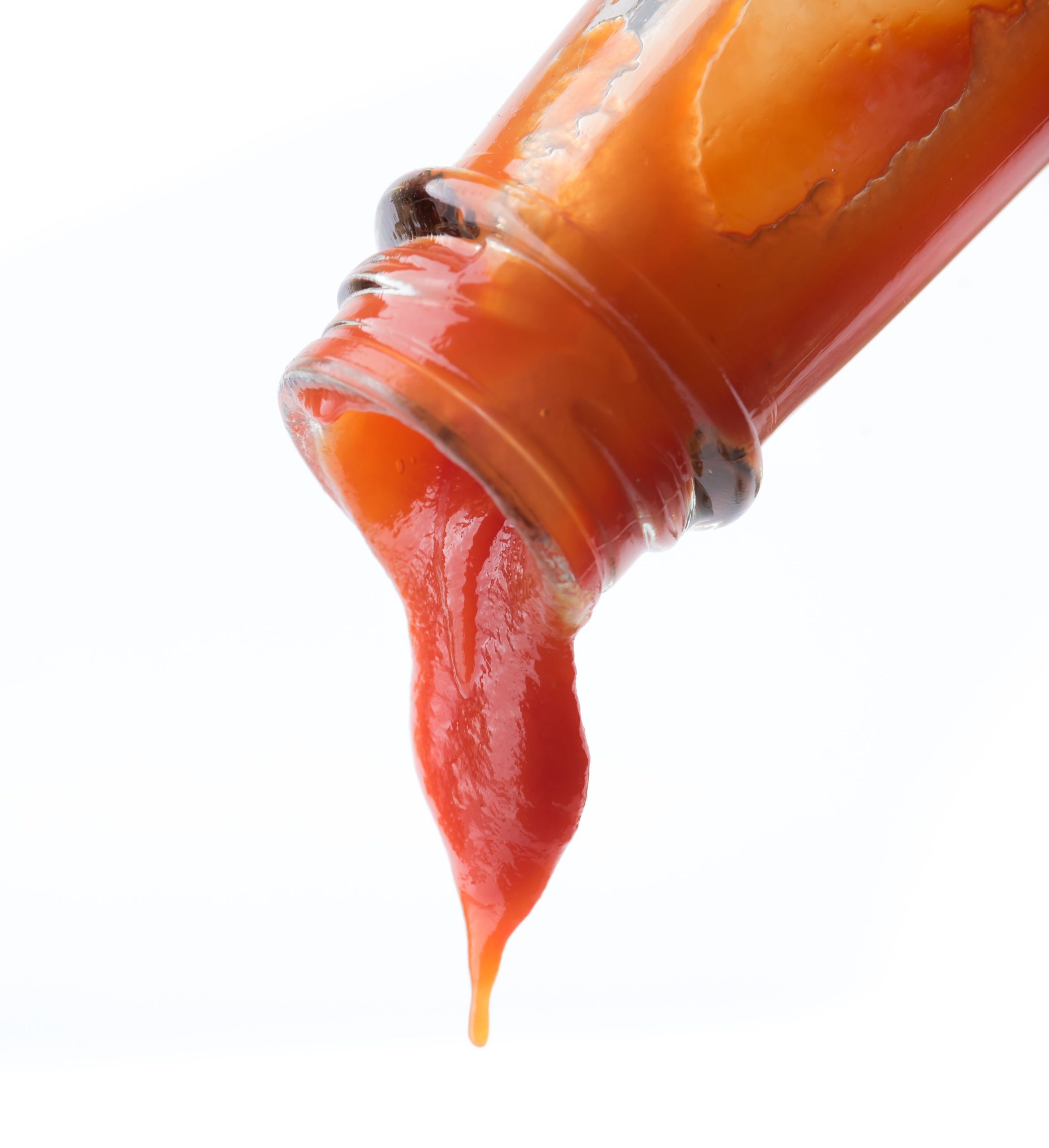 Tomato ketchup falling from bottle