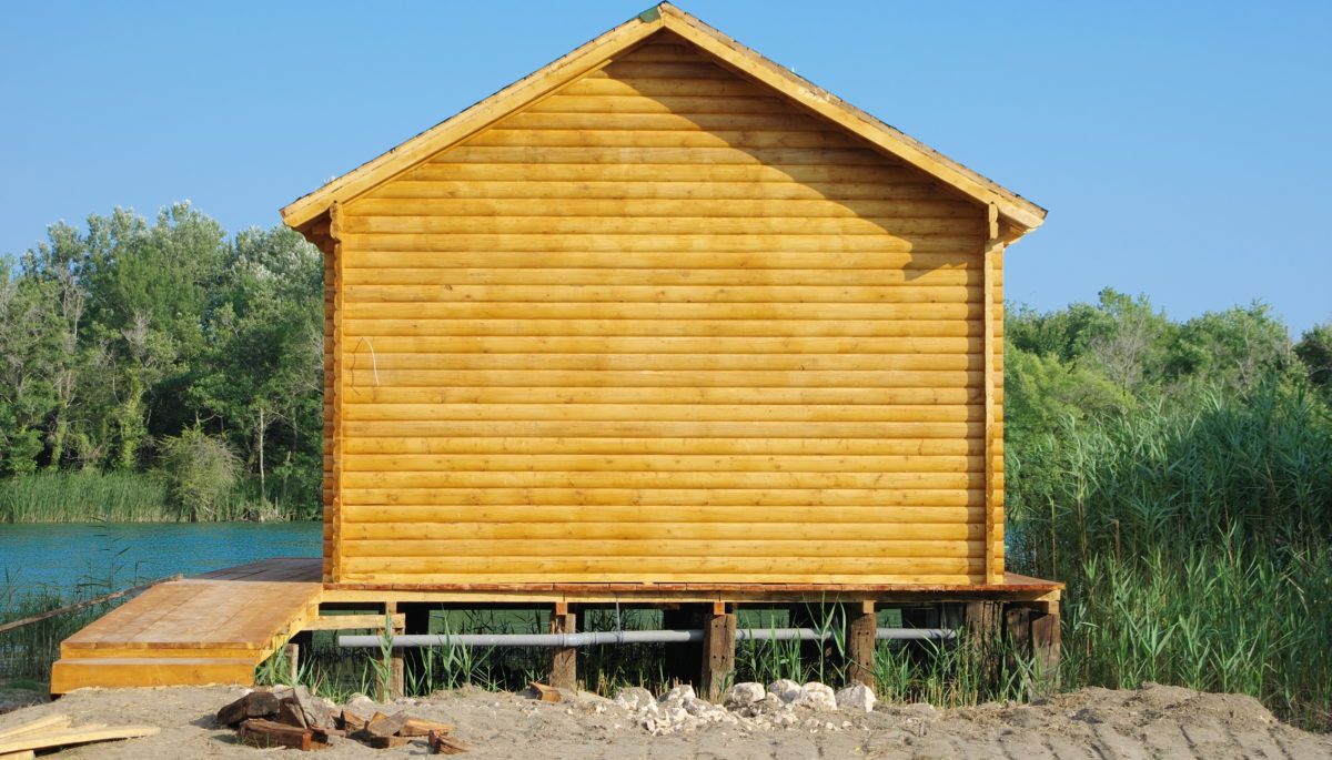 prefab-home-on-land-near-lake-in-country