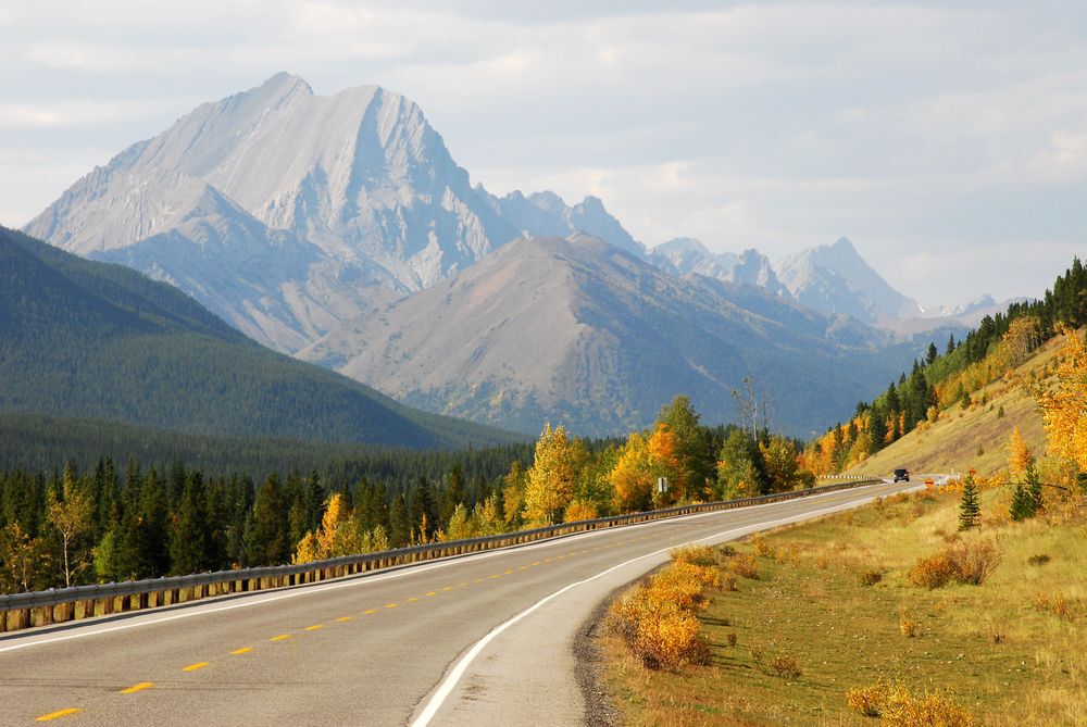 A highway goes through the Rockie Mountains