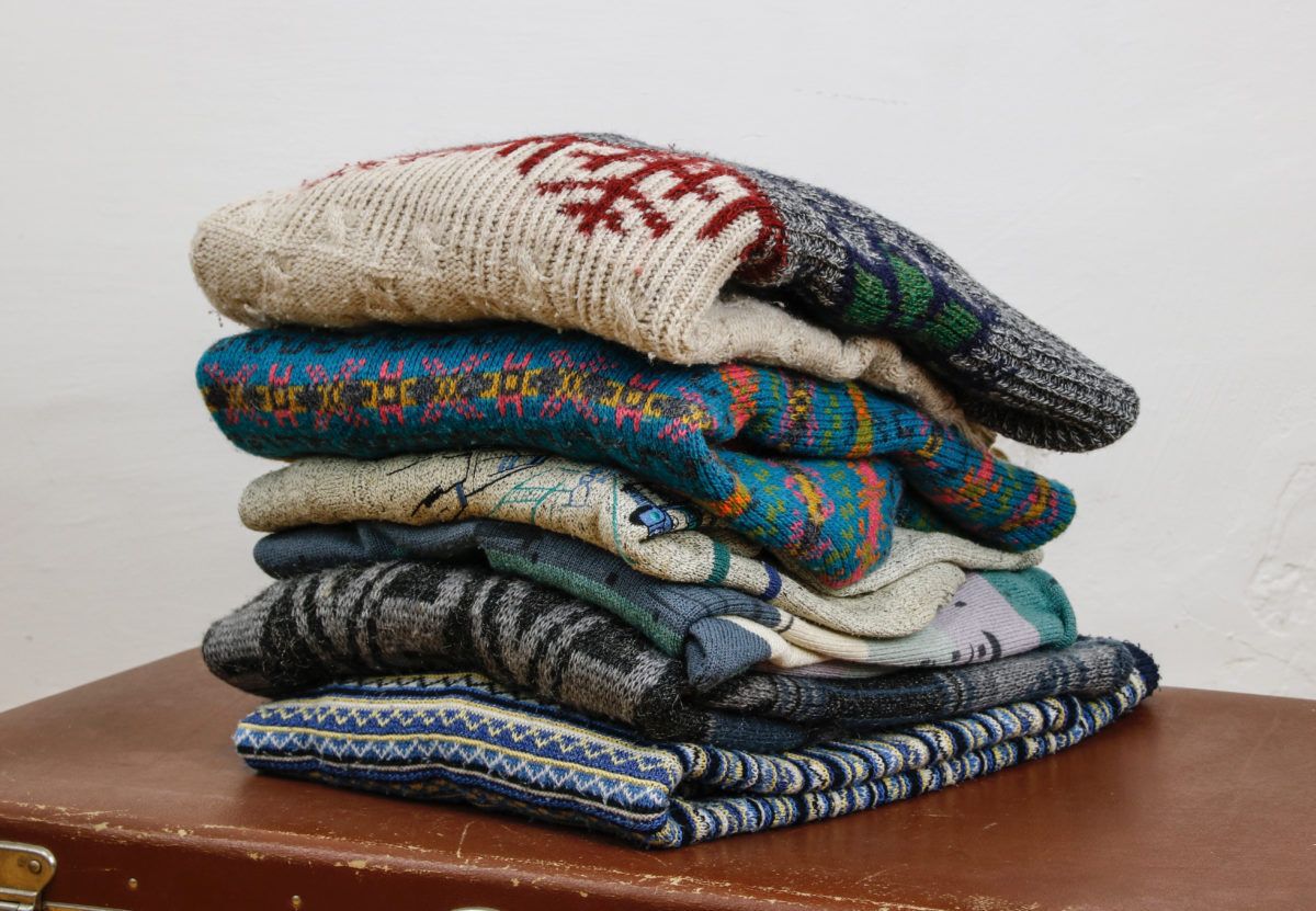 A pile of old wool sweaters